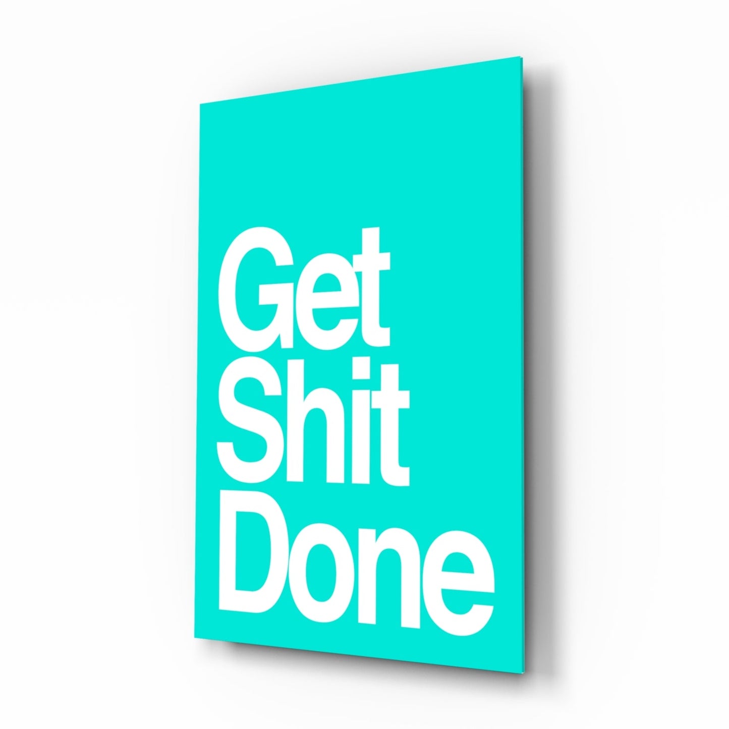 Turquoise glass wall art panel displaying white text "Get Shit Done" at an angled three-dimensional perspective view.