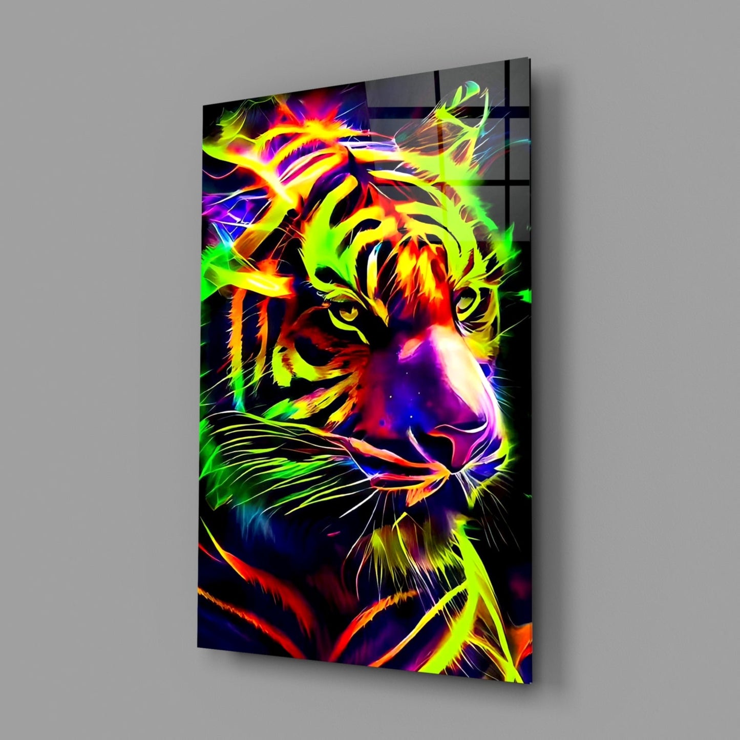 Neon tiger glass wall art displayed at an angle showing vibrant yellow, green, red, and blue fluorescent colors on black background.