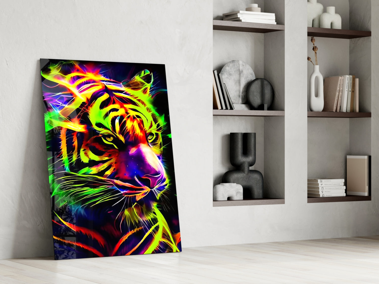 Neon tiger glass wall art leaning against white wall next to built-in shelving with books and decorative objects.