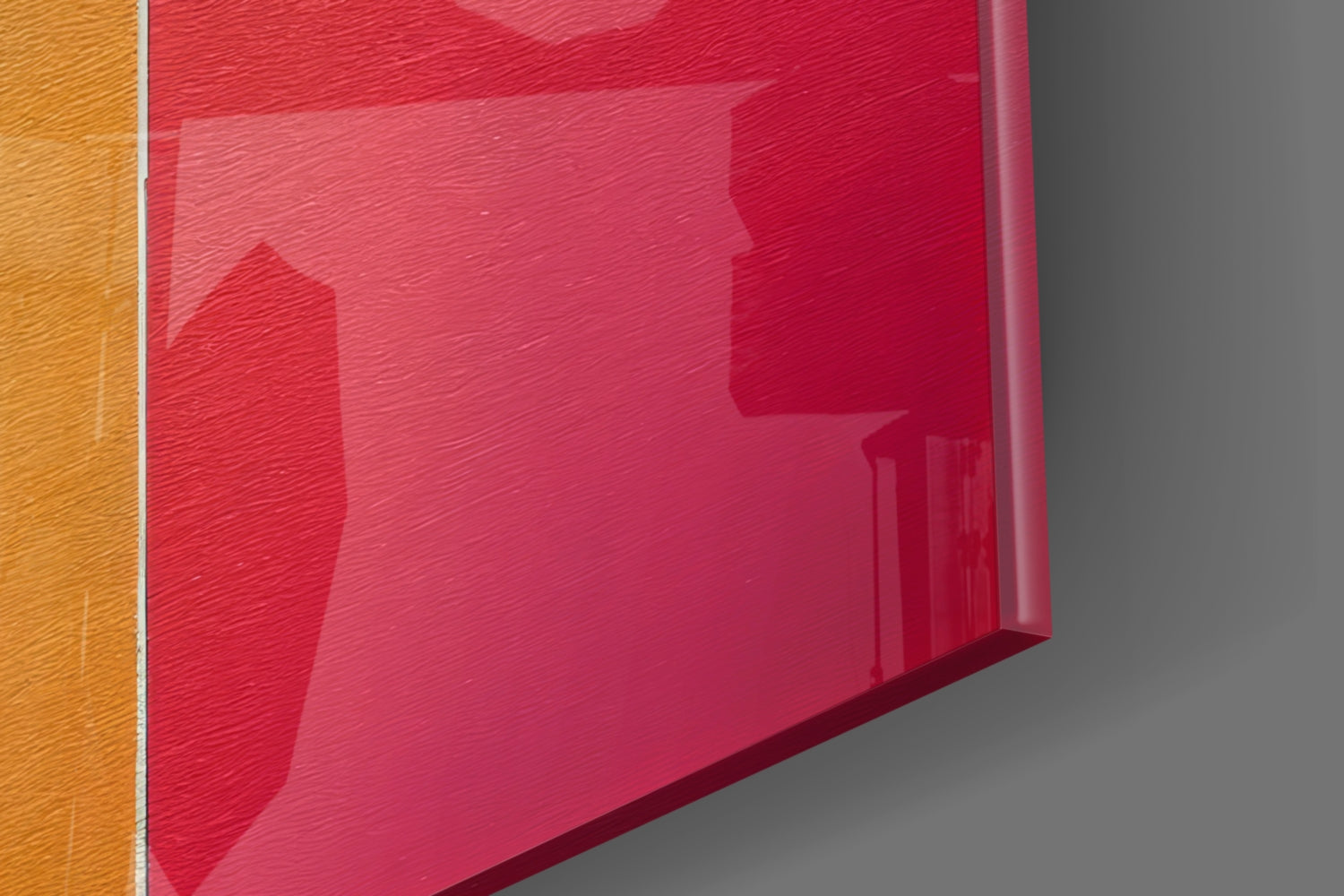 Red and orange glass wall art panels displayed at an angle against gray background, showing glossy surfaces and color gradients.