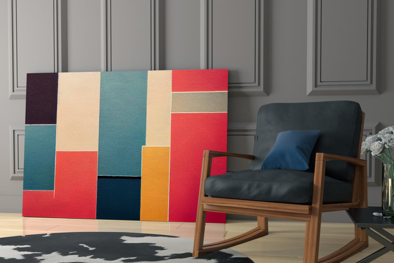 Colorful geometric glass wall art with red, teal, cream, orange, and navy rectangles displayed behind a wooden rocking chair in a modern interior.