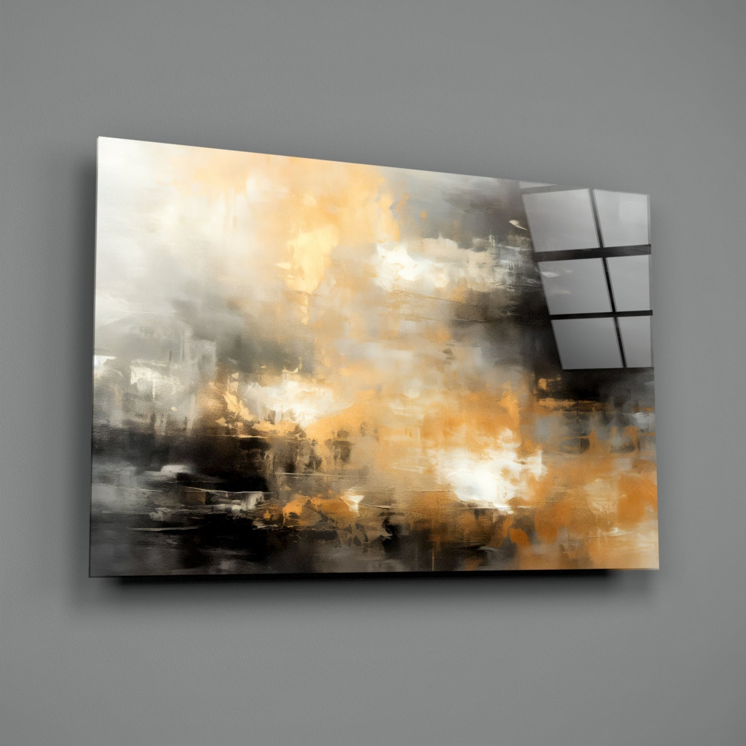 Abstract glass wall art panel with golden and gray brushstroke design mounted on gray wall, angled perspective view.