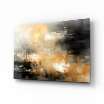 Abstract glass wall art panel featuring layered golden, orange, white, and charcoal gray brushstroke patterns, displayed at an angle.