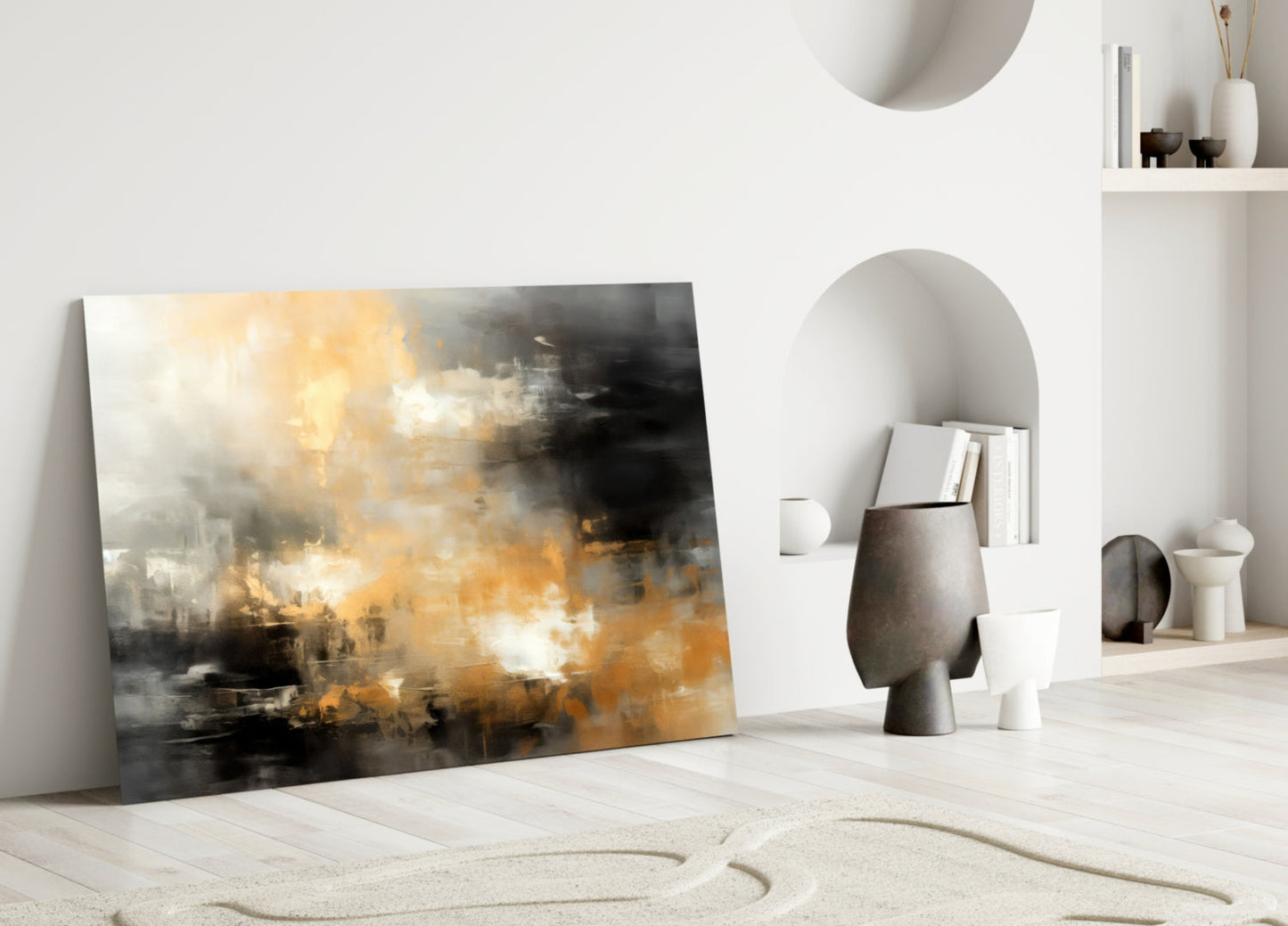 Abstract glass wall art leaning against white wall displaying golden, black, and white brushstroke composition in minimalist interior setting.