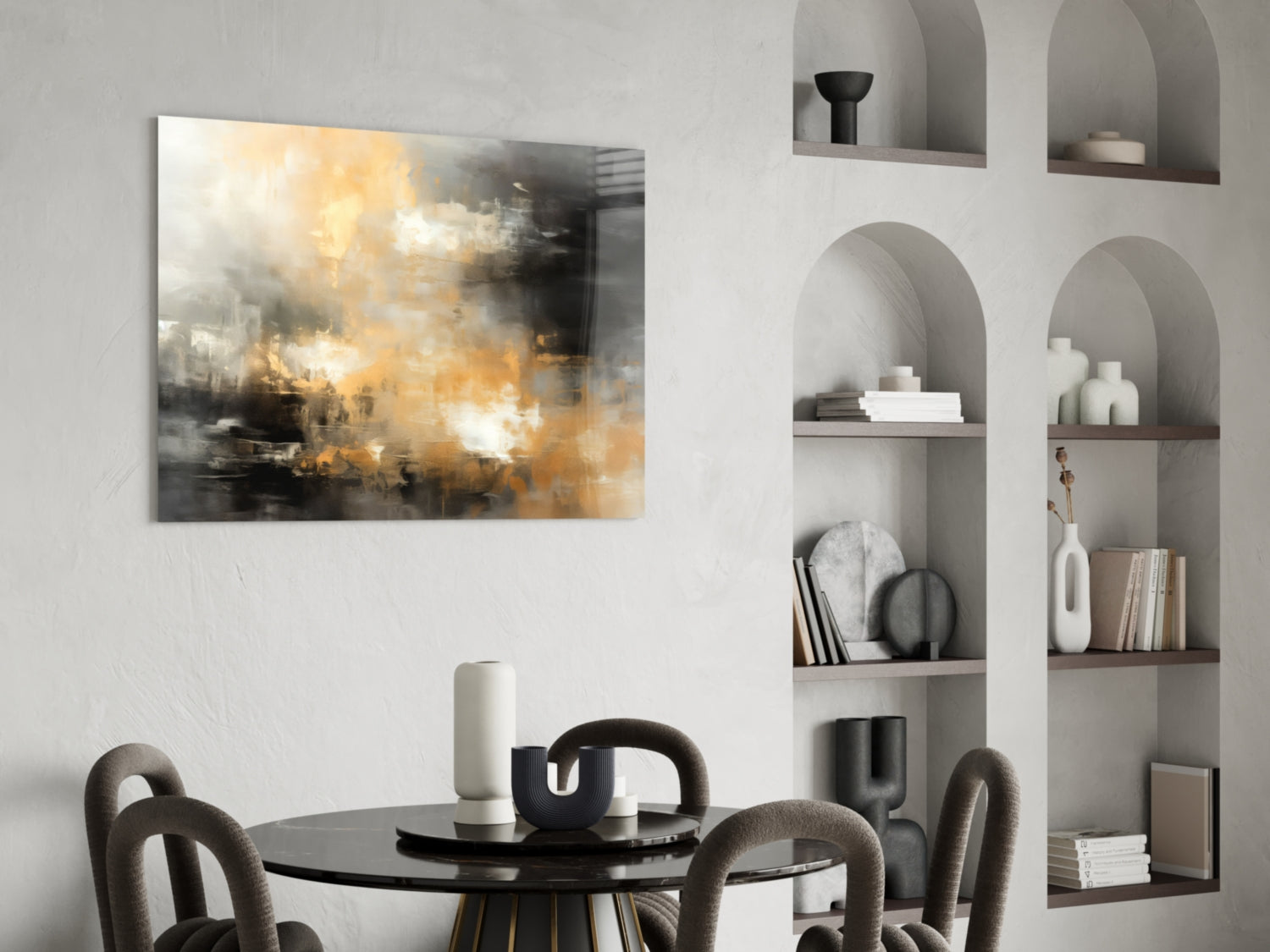Abstract glass wall art with golden, white, and charcoal brushstroke design displayed above dining table in modern interior.
