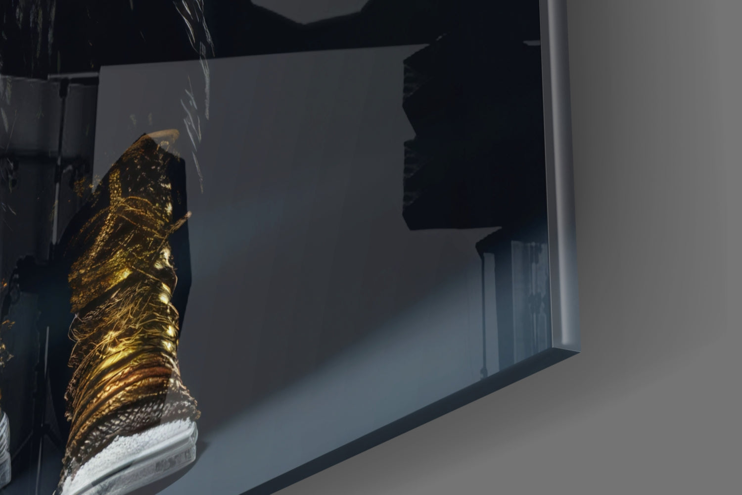 Gold and black textured glass art piece mounted on white wall, angled view showing dimensional surface detail.