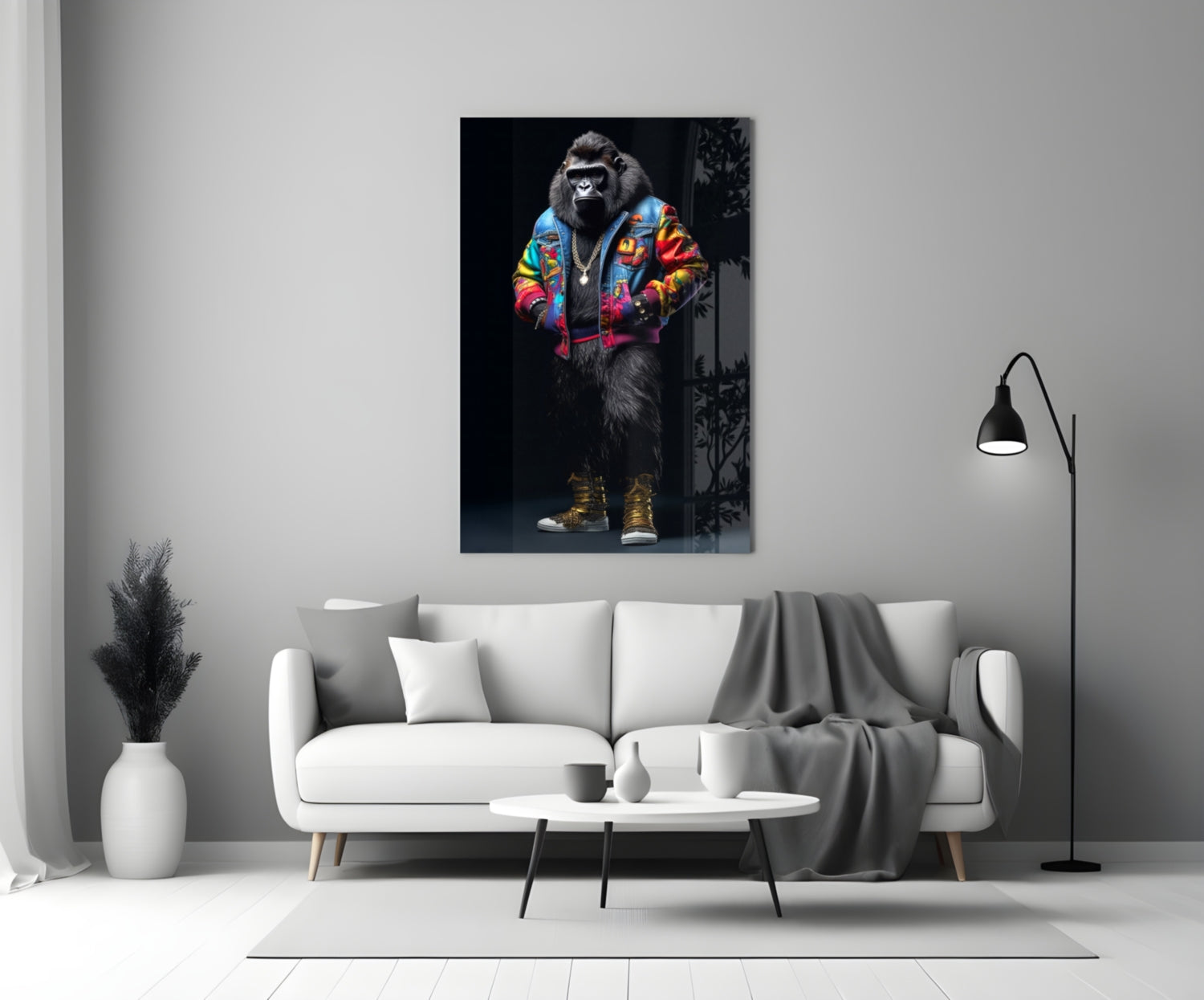 Colorful glass wall art depicting a stylized gorilla wearing a vibrant multicolored jacket and gold sneakers displayed above a white sofa in a modern living room.