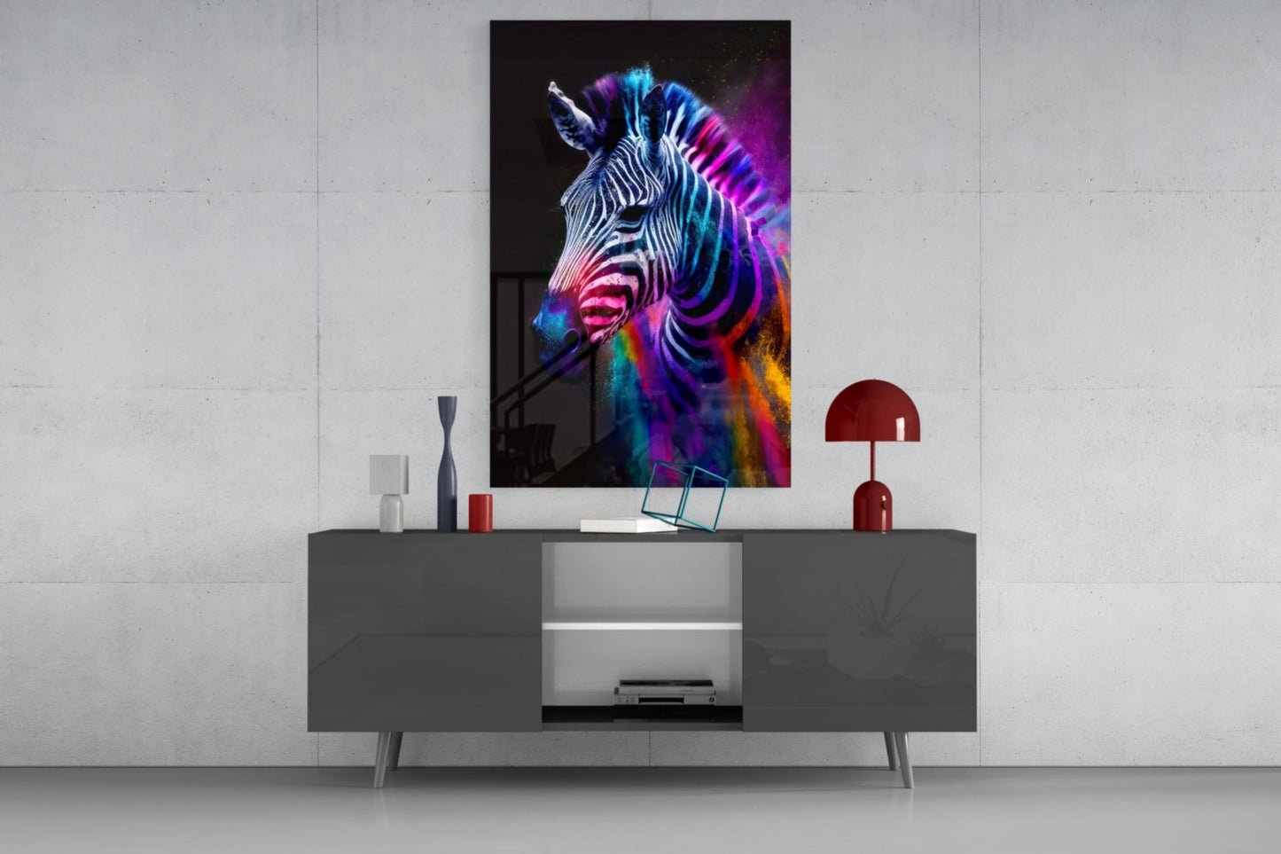 Colorful neon zebra portrait artwork displayed above gray media console with red desk lamp and decorative accessories.