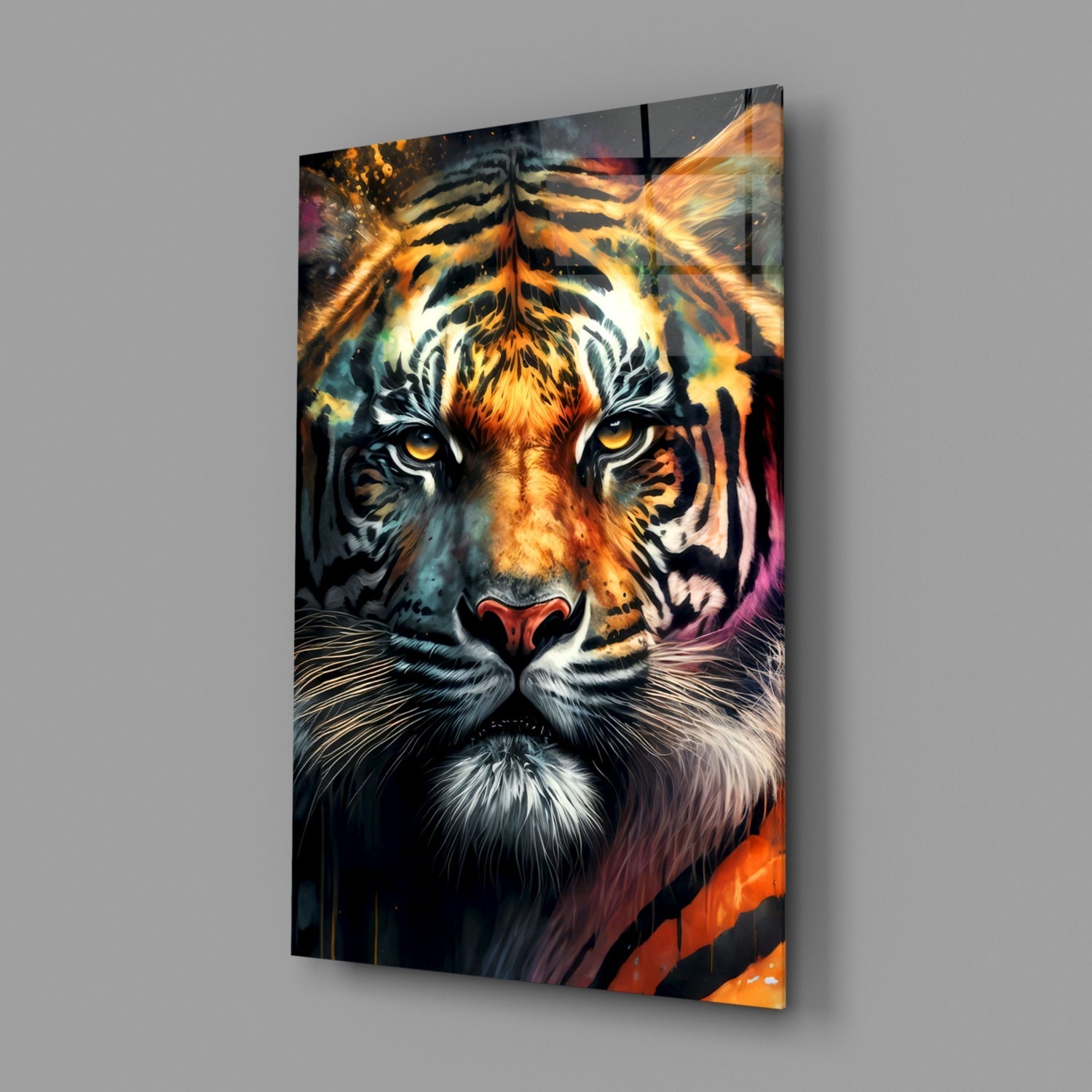 Vibrant tiger face glass wall art displaying golden eyes, orange and black stripes, and colorful abstract background, mounted at an angle.