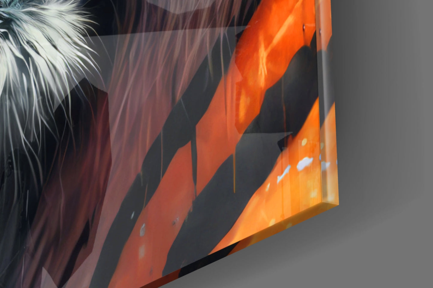 Close-up detail of glass wall art showing orange and red striped tiger face with white fur texture and black shadows against gray background.
