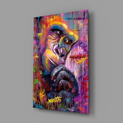 Colorful glass wall art featuring a vibrant portrait of a primate's face with rainbow paint drips and splatter effects.