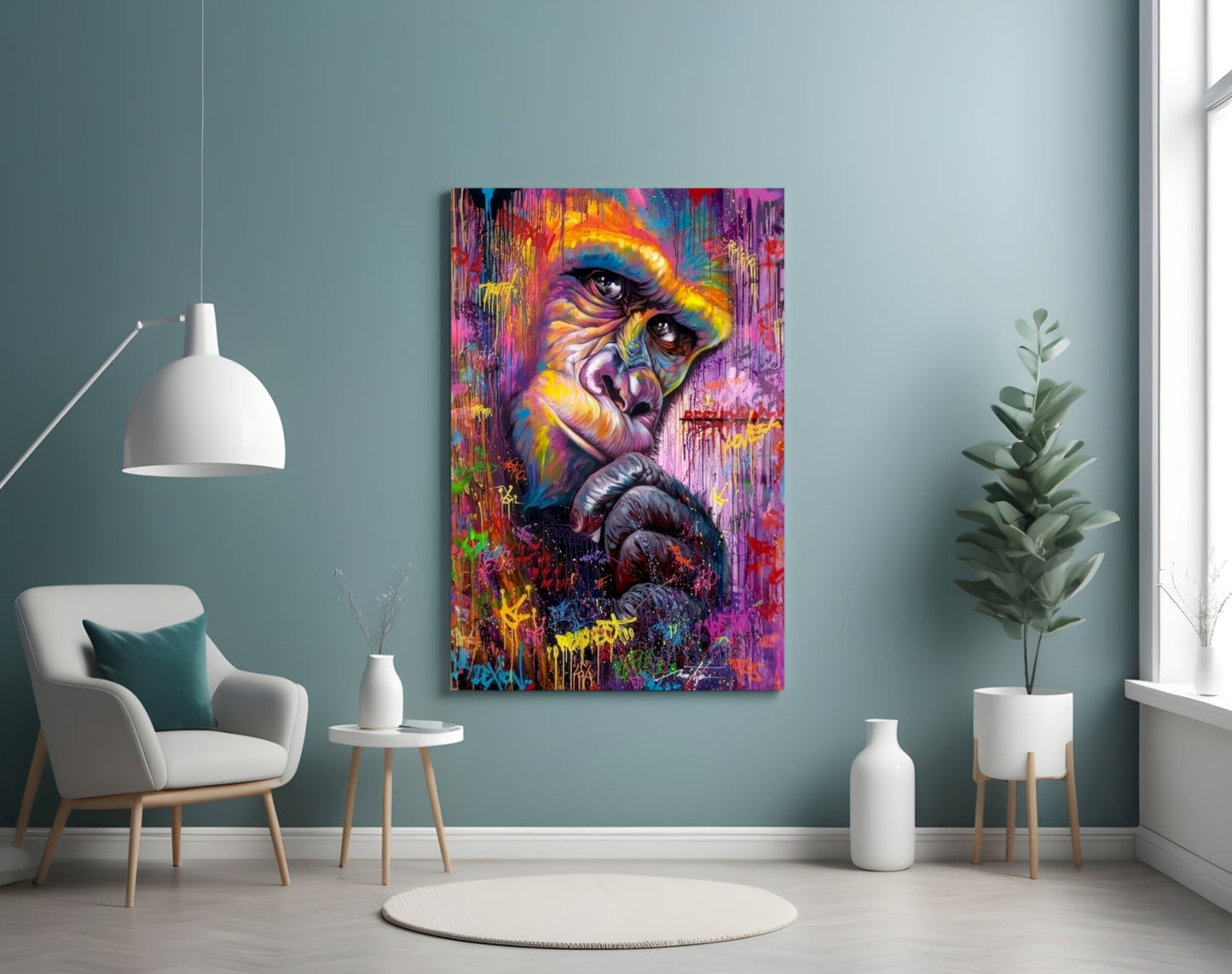Colorful abstract primate portrait on glass panel mounted above white chair in modern teal interior with plants and pendant lamp.