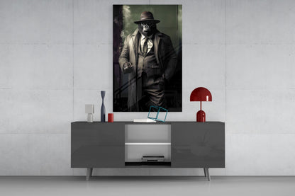 Portrait artwork of a chimpanzee in fedora and suit displayed above gray sideboard with red lamp and decorative accessories.