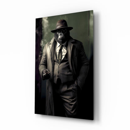 Angled side view of glass wall art depicting a chimpanzee in formal business attire with fedora hat and overcoat against muted green background.