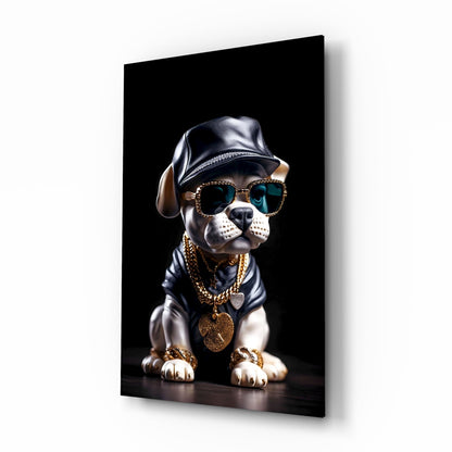 A stylized puppy wearing a black leather cap, rhinestone-studded sunglasses, and gold chain necklaces displayed on a black glass panel against a white background.