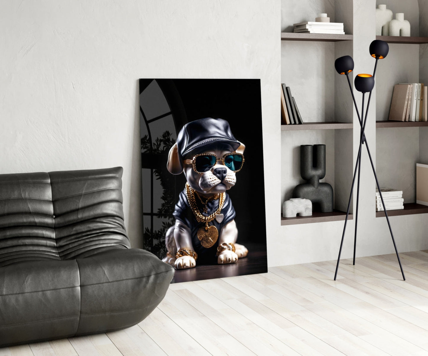 Modern living room featuring a stylish dog portrait artwork leaning against white wall beside gray sofa and shelving unit.