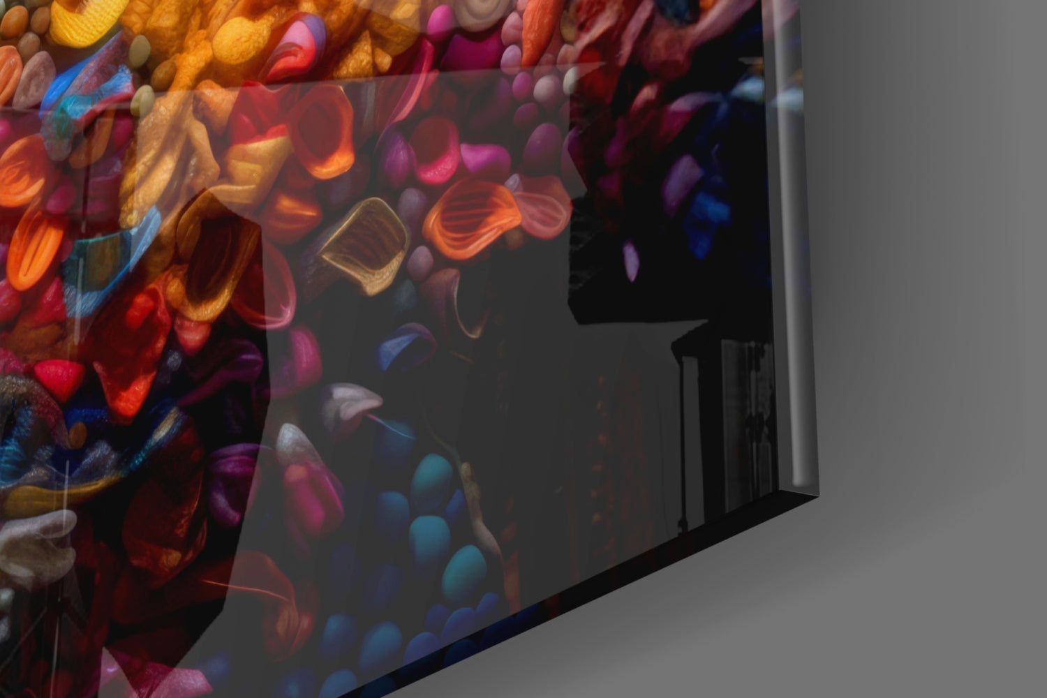 Colorful glass wall art panel displaying vibrant red, orange, pink, and blue abstract lips and flowers design against gray wall.