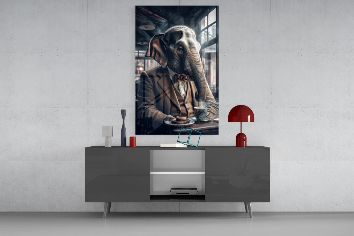 Framed glass wall art depicting an elephant in formal attire seated at a table, displayed above a gray media console in a modern interior setting.