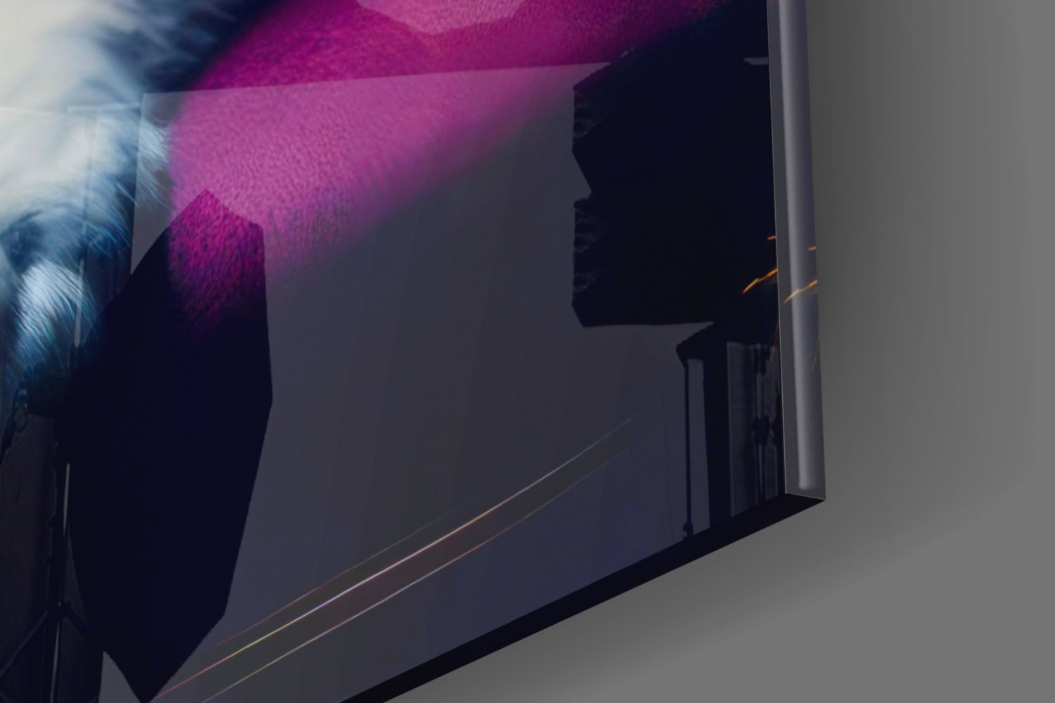 Angled view of glass wall art displaying magenta and blue gradient with silhouetted profile against dark background.