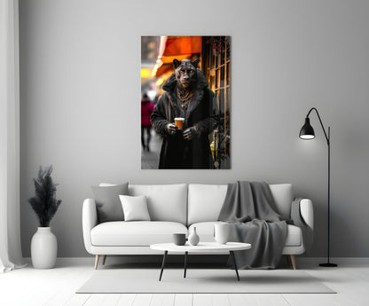 Glass wall art print displayed above a white sofa showing a leopard wearing a black coat and gold chain holding a coffee cup in an urban street setting.