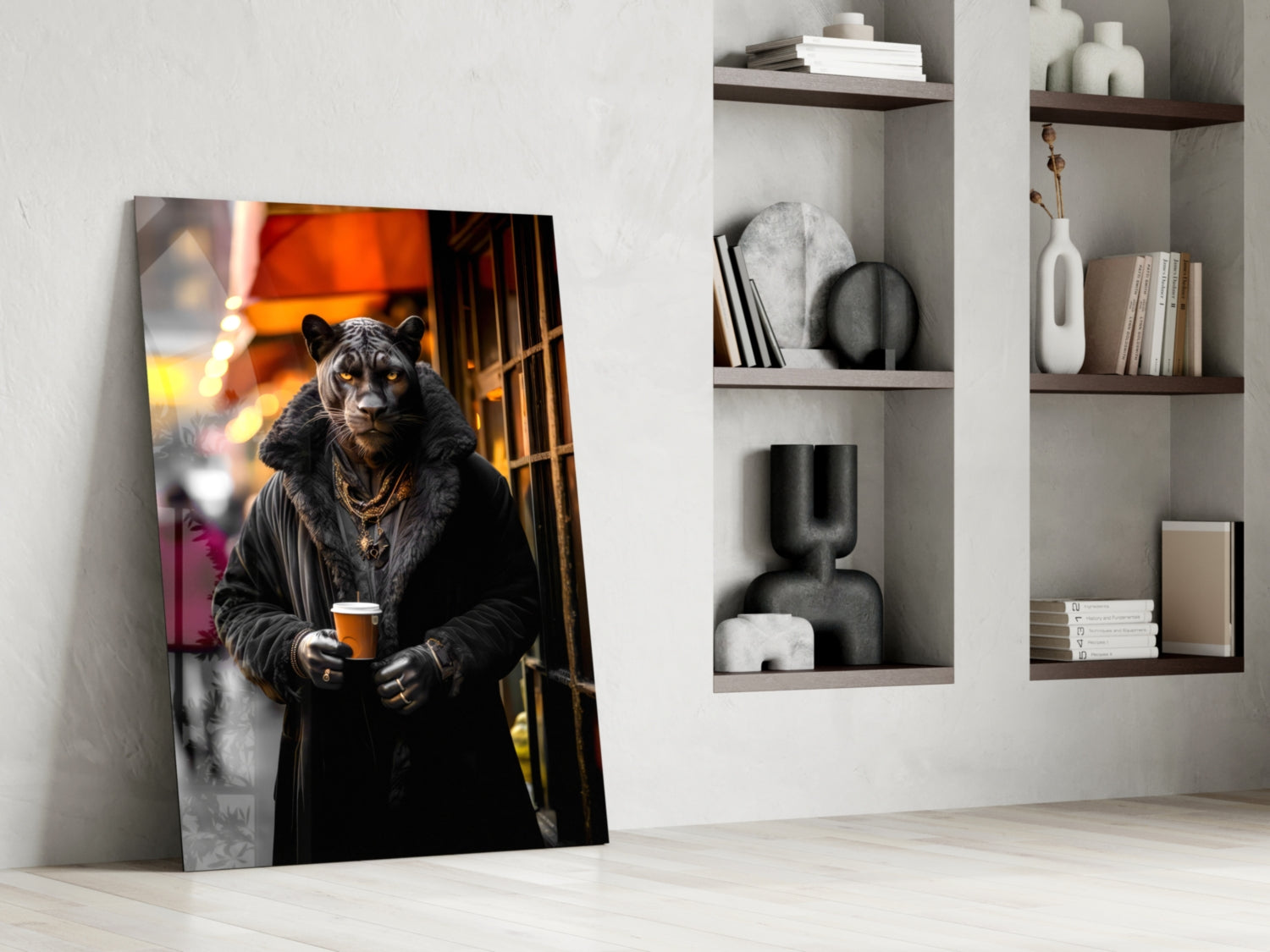Glass wall art leaning against white wall displays stylized black leopard in gold chain holding beer cup against warm orange backdrop.