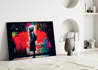 Hooded Kid Facing Red Paint Splash Glass Wall Art