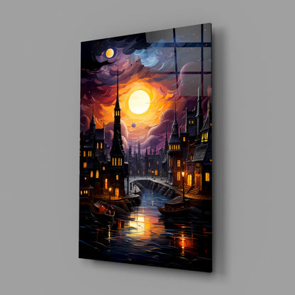 Angled perspective of glass wall art featuring a moonlit Gothic cityscape with illuminated buildings, boats, and glowing sun against purple and orange sky.