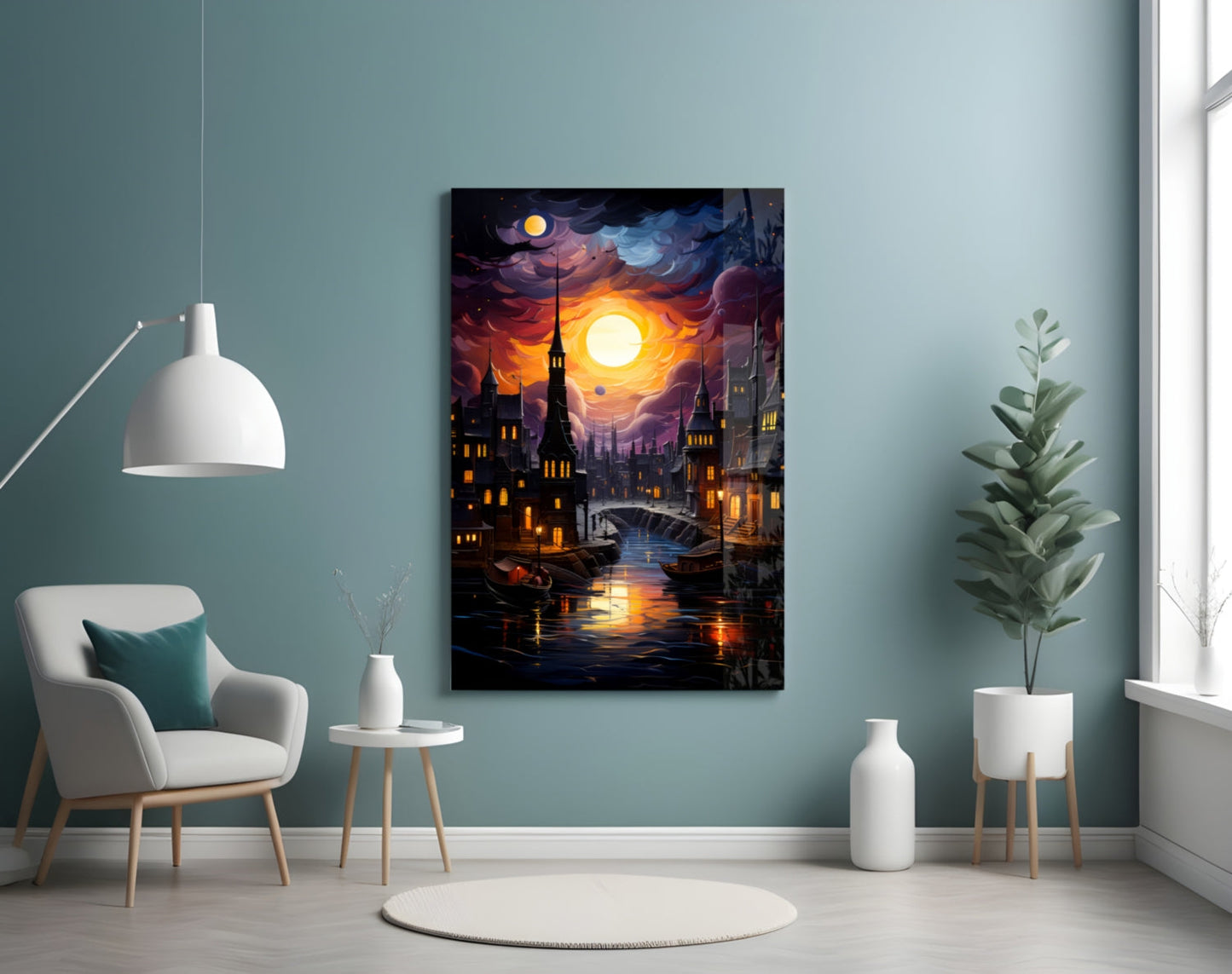 Moonlit fantasy cityscape with glowing buildings, moon, and water reflection displayed on wall above white chair in teal room.