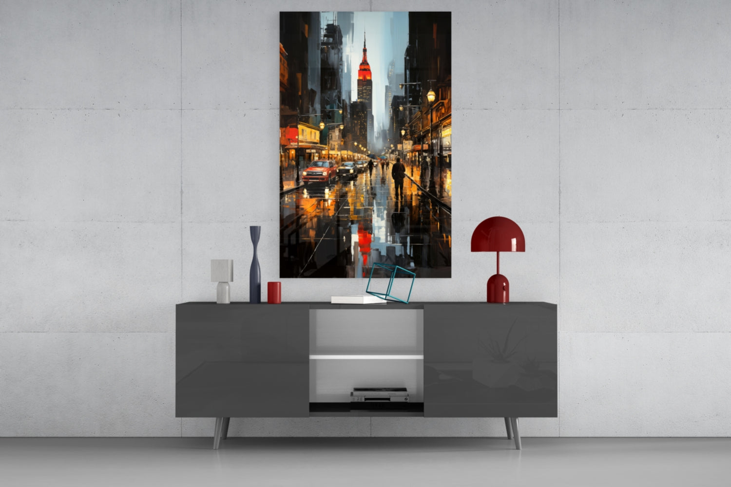 Modern living room setup showing City Night Glass Wall Art depicting rainy New York street scene with illuminated buildings and Chrysler Building, displayed above gray media console with red decorative accessories.