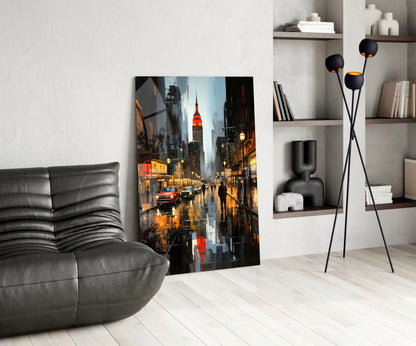 Modern living room with gray leather chair, rainy New York City street scene glass art leaning against white wall, black floor lamp, and shelving unit.