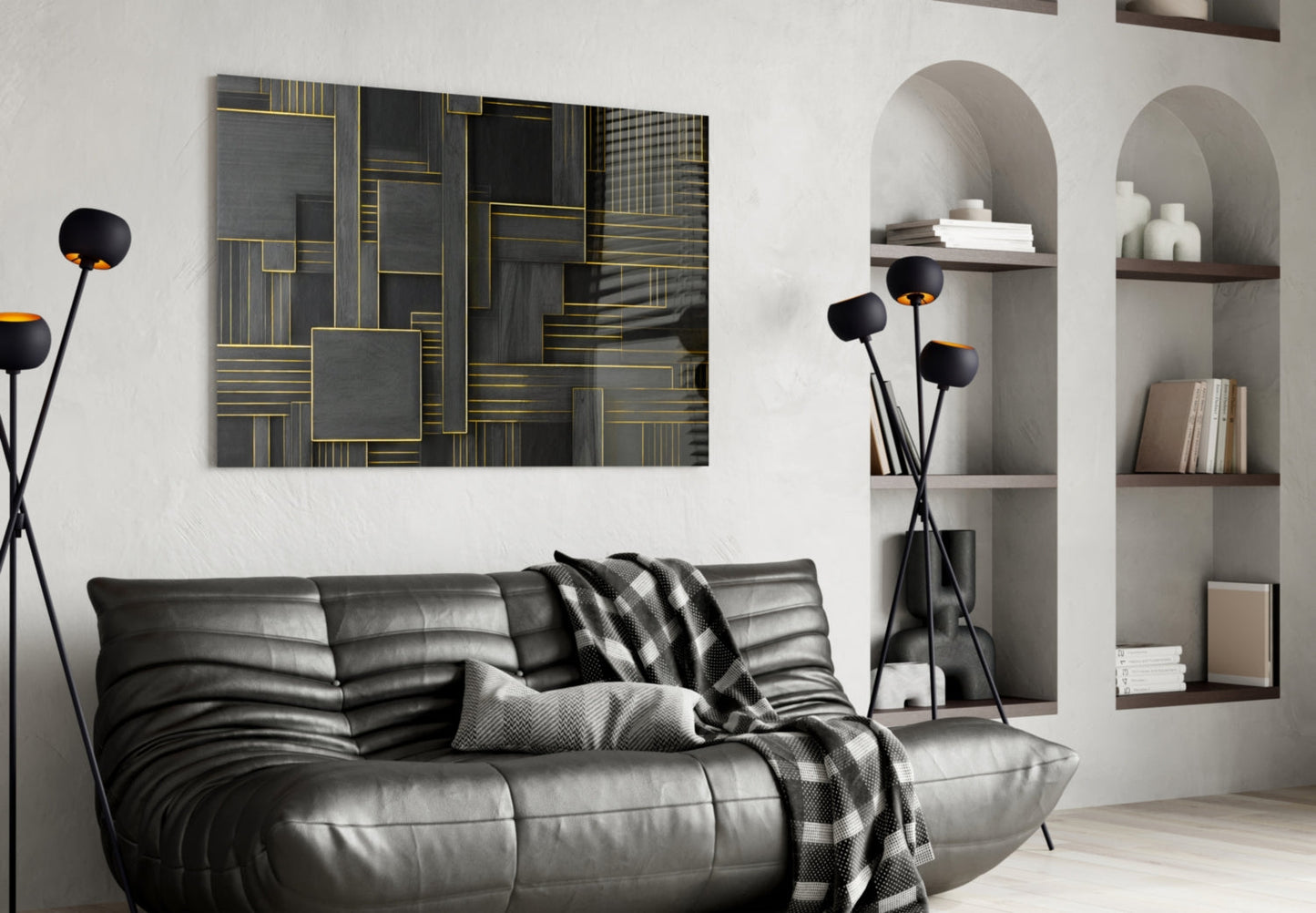 Black and gold geometric glass wall art displayed above a gray leather sofa in a modern living room interior.