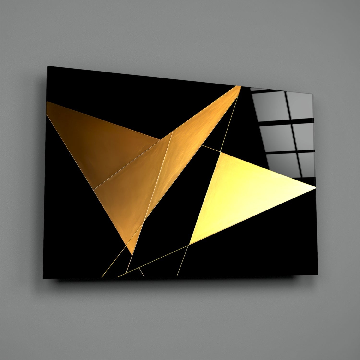 Modern glass wall art panel displaying two geometric triangular shapes in gold and yellow tones against black background with metallic line details.