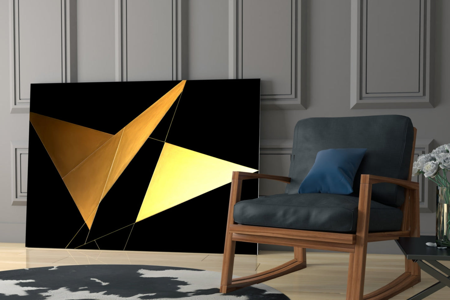 Modern living room scene featuring geometric glass wall art with golden and yellow triangular shapes on black background beside mid-century wooden chair.