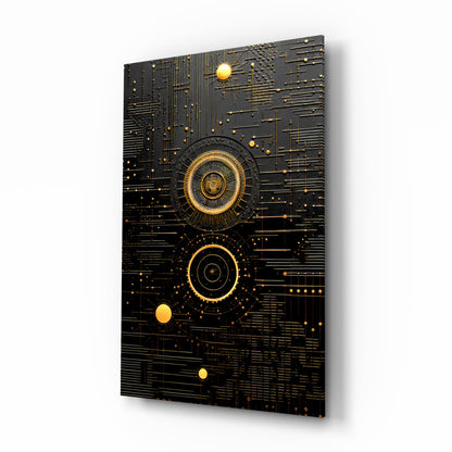 Black glass wall art panel with gold circular concentric designs and scattered spheres against circuit board-like patterns, displayed at an angle.