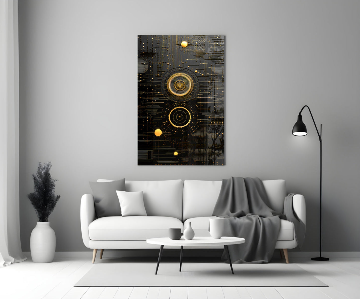 Black and gold steampunk-style glass wall art with concentric circles and circuit patterns displayed above a white sofa in a modern living room setting.