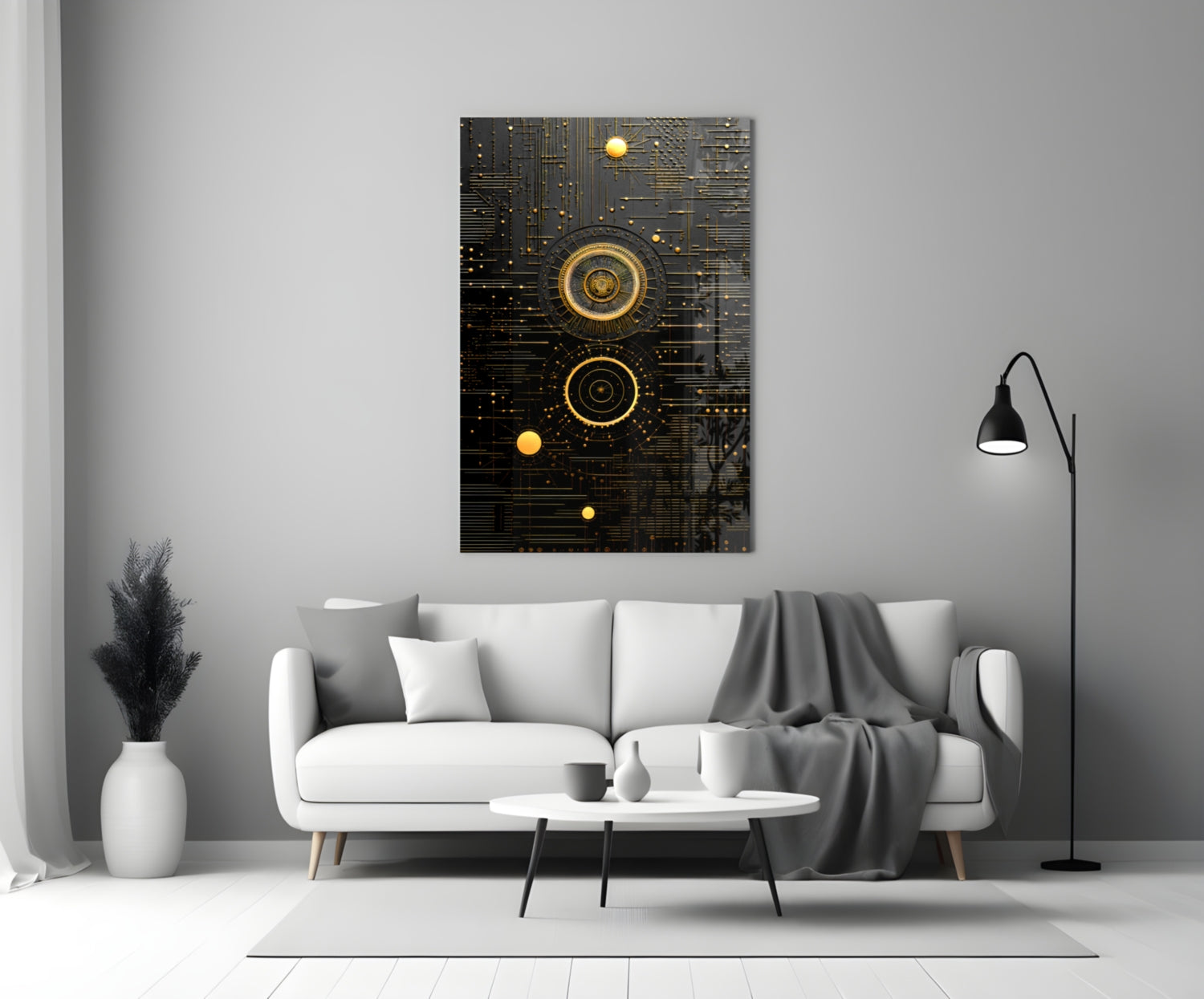 Black and gold steampunk-style glass wall art with concentric circles and circuit patterns displayed above a white sofa in a modern living room setting.