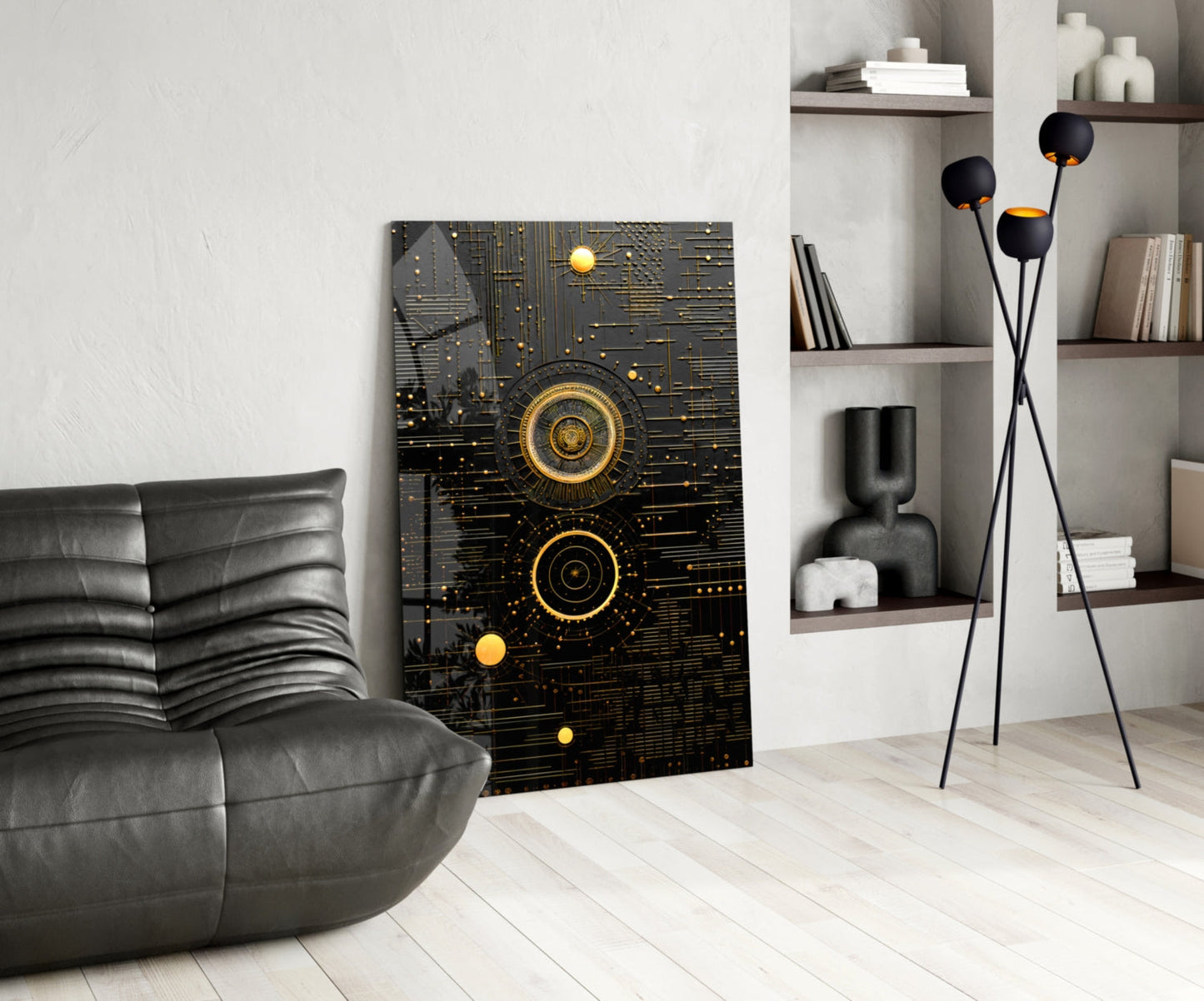 Black and gold geometric circuit board wall art displayed in modern living room with gray leather chair and shelving unit.