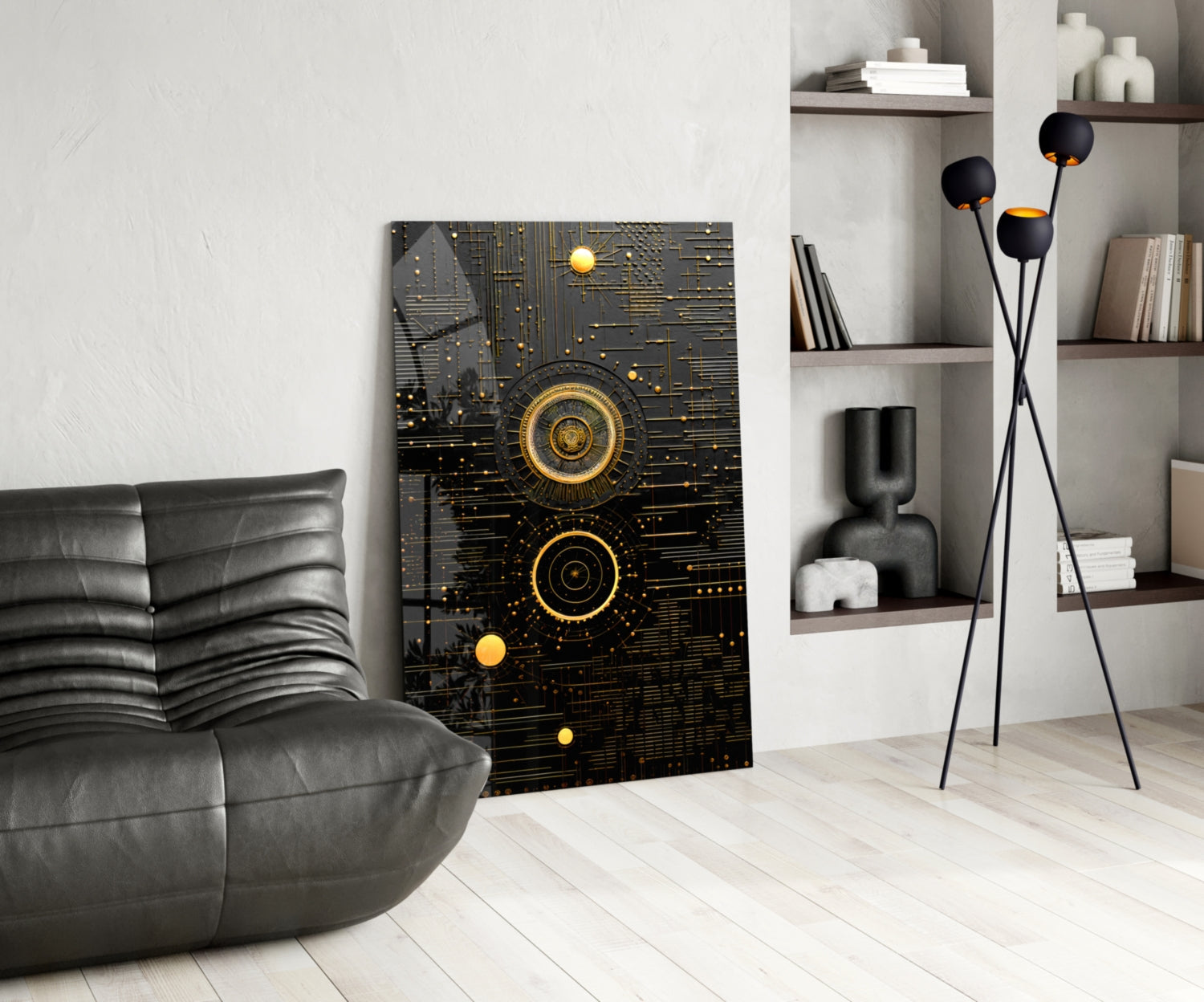 Black and gold geometric circuit board wall art displayed in modern living room with gray leather chair and shelving unit.