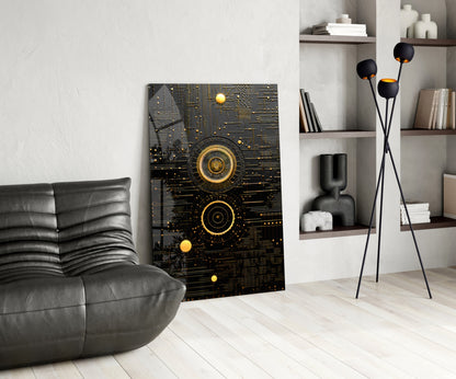 Black and gold geometric circuit board wall art displayed in modern living room with gray leather chair and shelving unit.