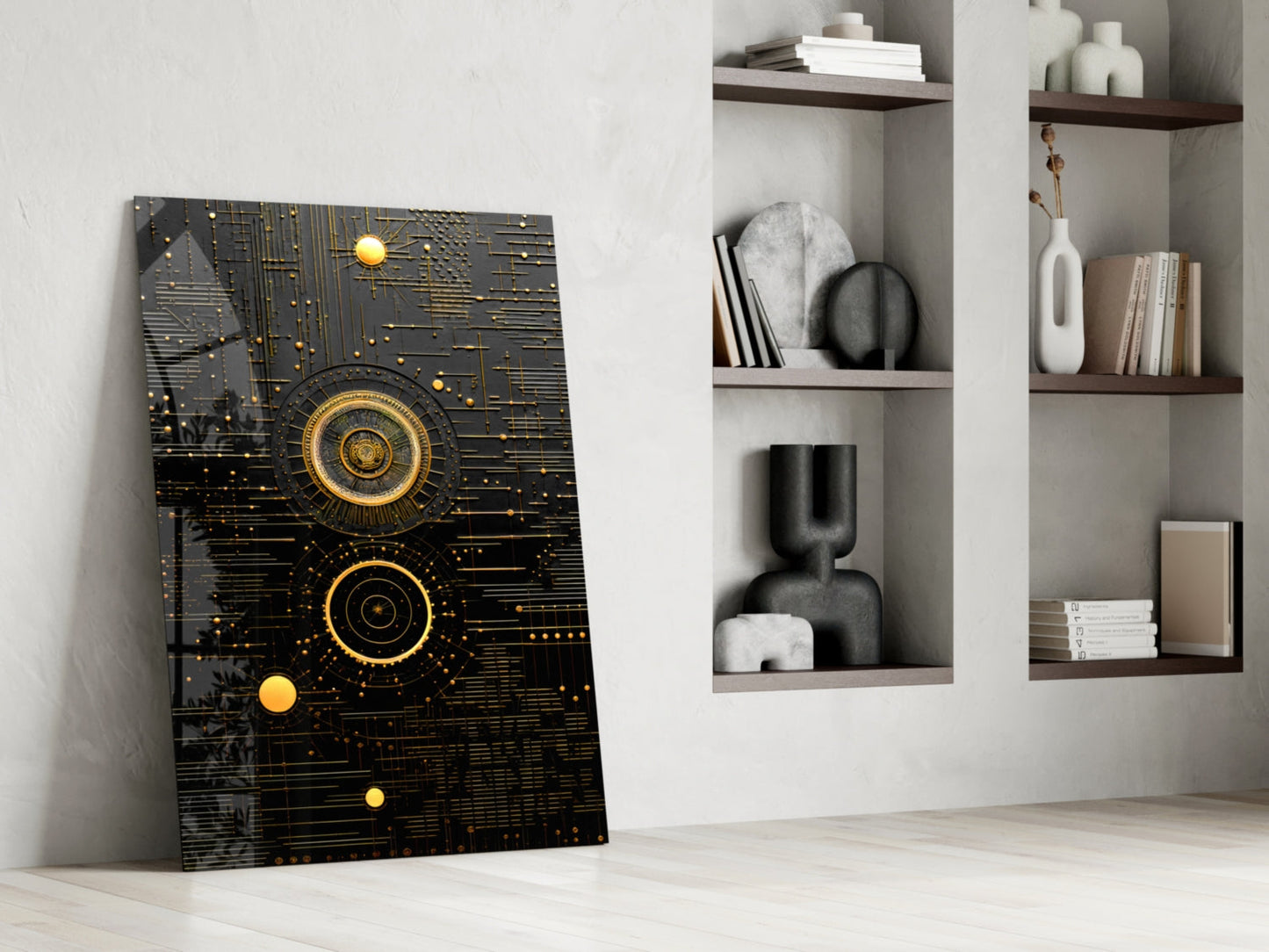 Black glass panel with gold geometric circles and circuit patterns leaning against white wall beside shelving unit.