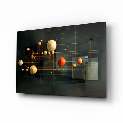 Modern glass wall art panel featuring golden and orange spheres with geometric gold line patterns on dark background, angled perspective view.