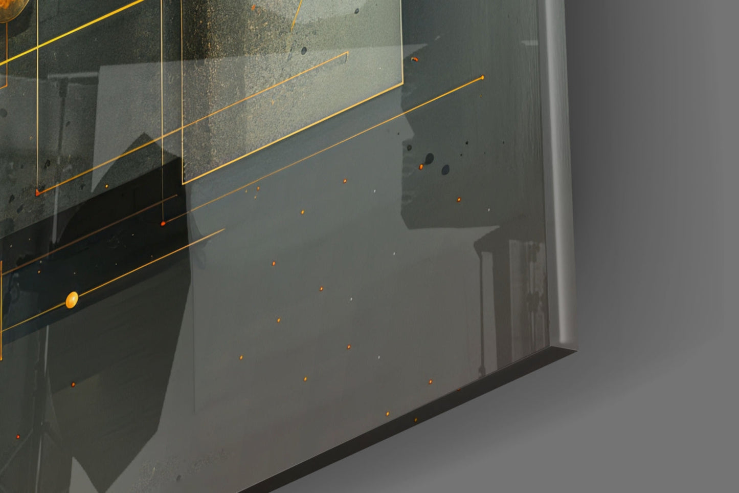 Close-up of glass wall art showing orange lines and dots on textured gray-green surface with shadow detail.