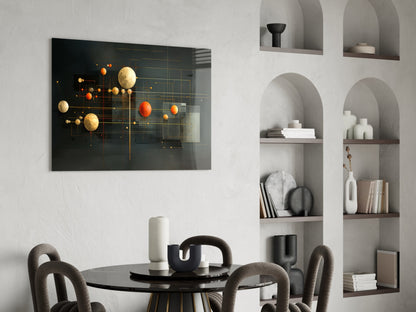 Modern dining room featuring black glass wall art with gold and orange spheres on geometric grid, displayed above round black table with gray upholstered chairs and white built-in shelving.