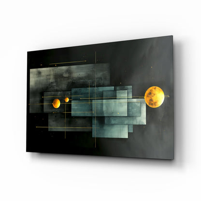 Modern glass wall art featuring two glowing golden planets connected by geometric teal and gray overlapping rectangles with gold grid lines on black background, angled perspective view.