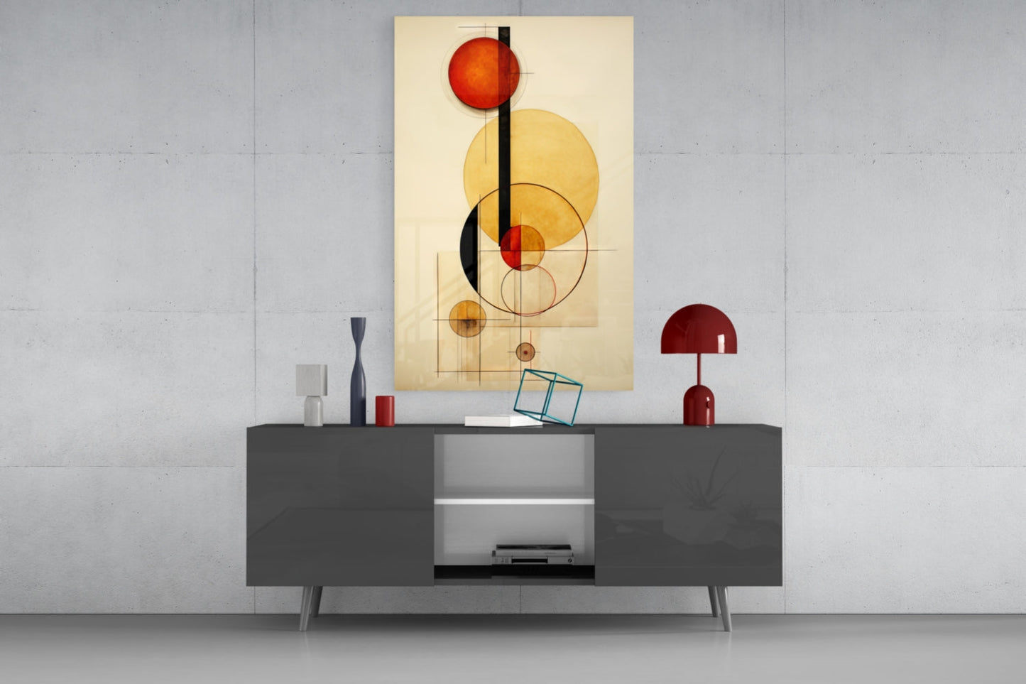Modern living room display featuring geometric abstract wall art with red and yellow circles on cream background, hung above dark gray media console with red decorative lamp.