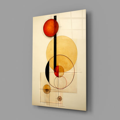 Modern glass wall art panel displaying overlapping circles in red, yellow, and black with geometric grid lines on cream background, angled three-quarter view.