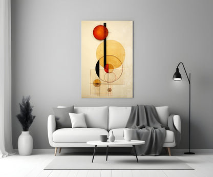 Abstract geometric glass wall art with red, yellow, and black circles and lines displayed above a white sofa in a modern living room.