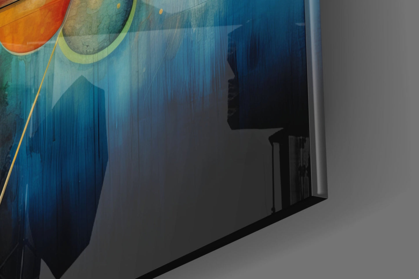 Angled view of colorful glass wall art with orange and blue gradient design, mounted on white wall with shadow cast across surface.