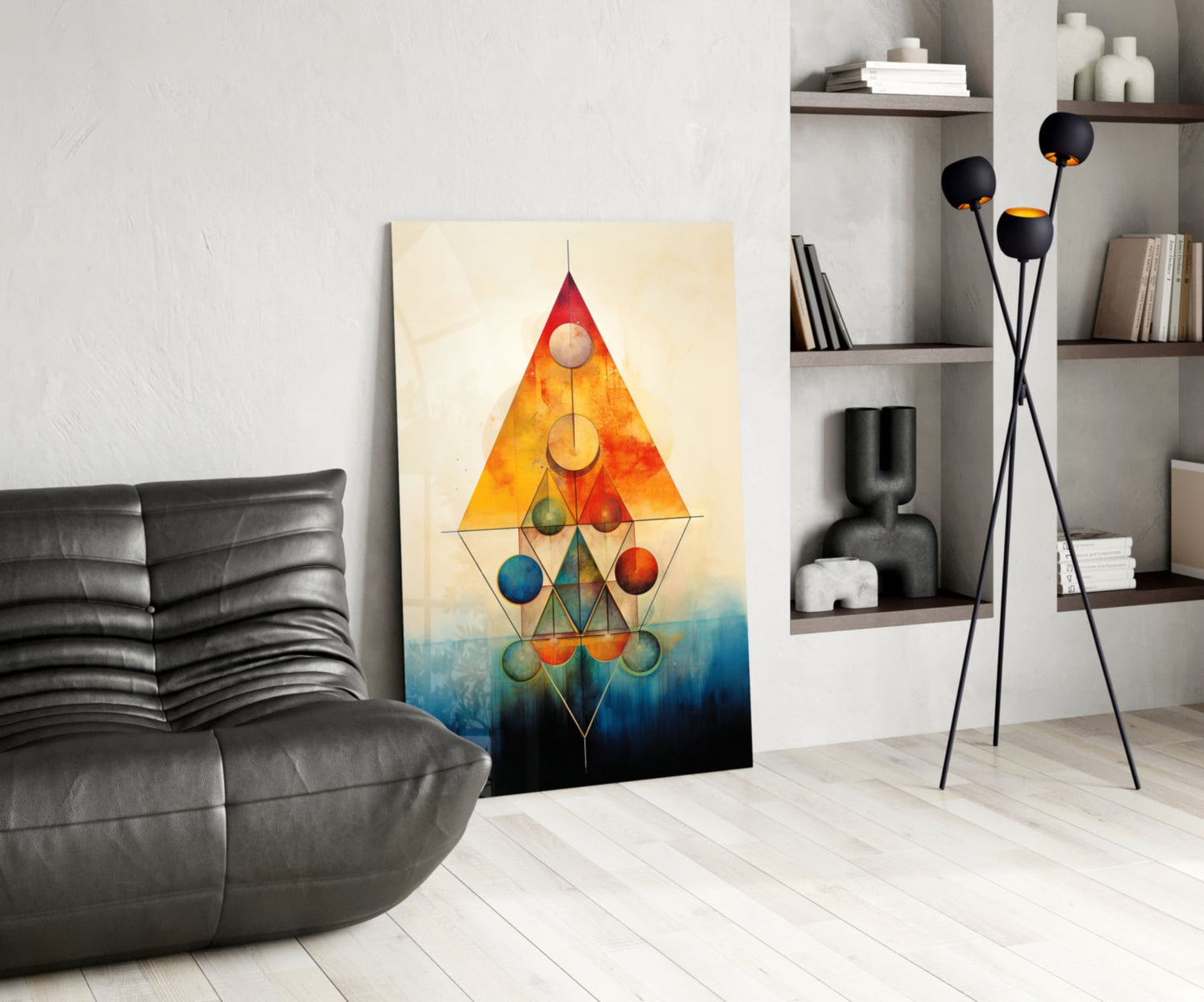 Modern living room interior featuring geometric glass wall art with colorful spheres arranged in triangular composition against cream background.
