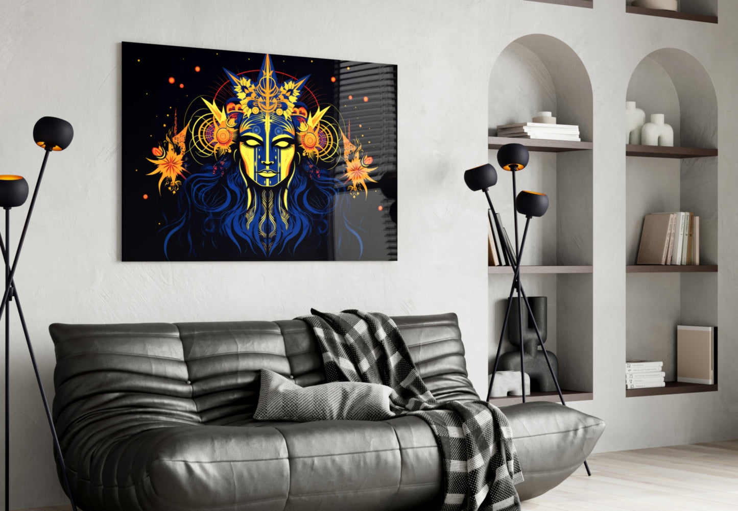 Black glass wall art featuring a mystical face with yellow skin, blue hair, and gold celestial imagery displayed above a gray leather sofa in a modern living room.